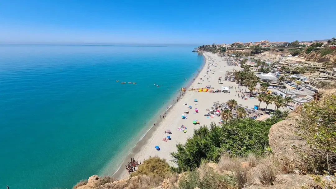 Burriana beach in Nerja seen from above, with turquoise water